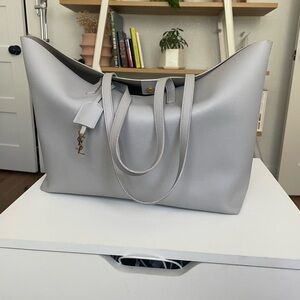 YSL East West tote in Granite (a blue gray).

Certificate and receipt included.